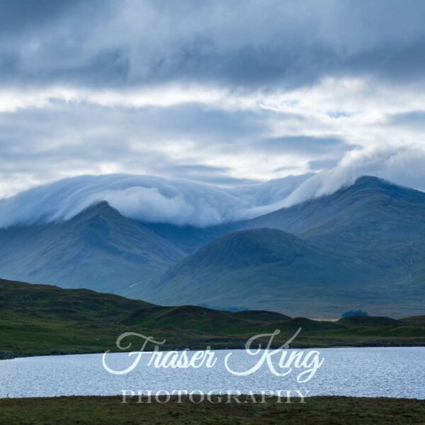 Clouds hugging the tops